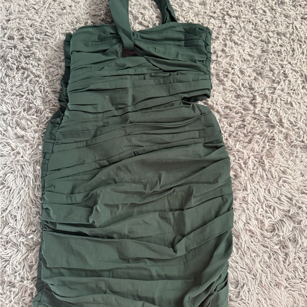 Dark green mini dress. Only worn once. Flattering side cut out.